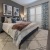 a bedroom with a bed and lamps